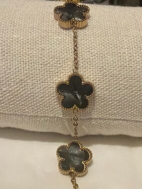 Gold-Tone Bracelet with Black Mother-of-Pearl Clover Accents